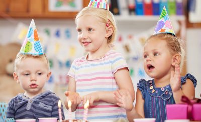 Shot of a preschool children celebrating a birthday in class.
